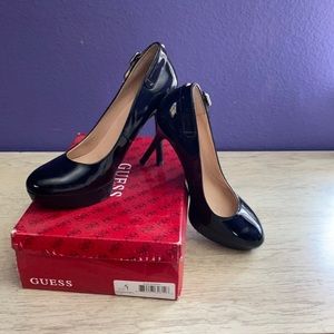 Guess Black patent leather platform heels.